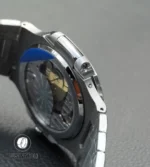 Side view of the Nautilus 5712/1A-001 with integrated lugs and sapphire exhibition caseback, offering a clear display of the movement.