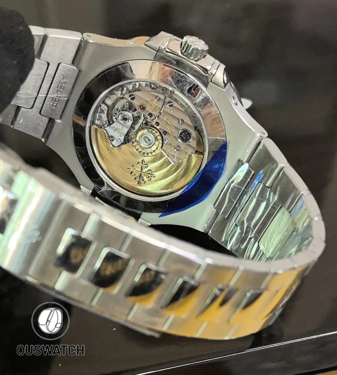 Rear view of the Nautilus 5726/1A, showing the stainless-steel bracelet, folding clasp, and sapphire exhibition caseback with visible automatic movement.