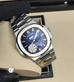 Full frontal view of the Nautilus 5726/1A, showing the horizontal embossed blue dial, annual calendar windows, and moon phase aperture at six o’clock.