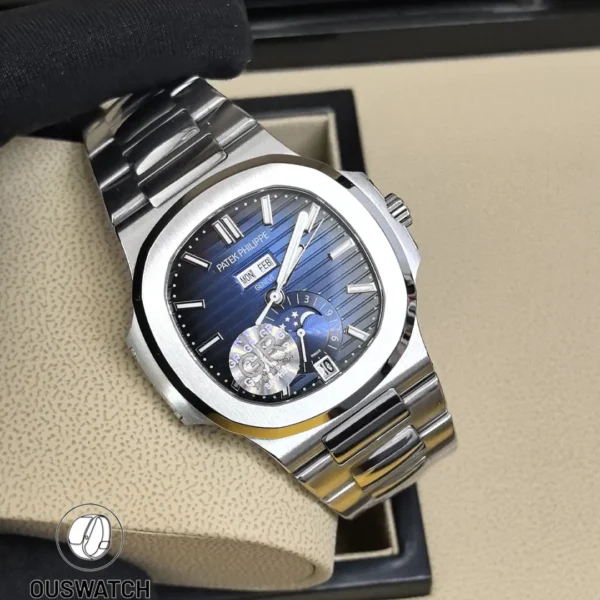 Full frontal view of the Nautilus 5726/1A, showing the horizontal embossed blue dial, annual calendar windows, and moon phase aperture at six o’clock.