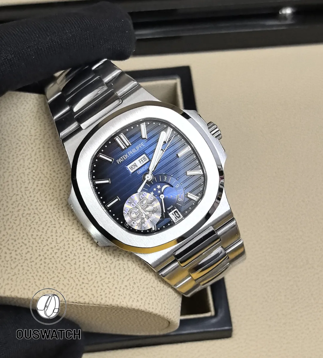 Full frontal view of the Nautilus 5726/1A, showing the horizontal embossed blue dial, annual calendar windows, and moon phase aperture at six o’clock.