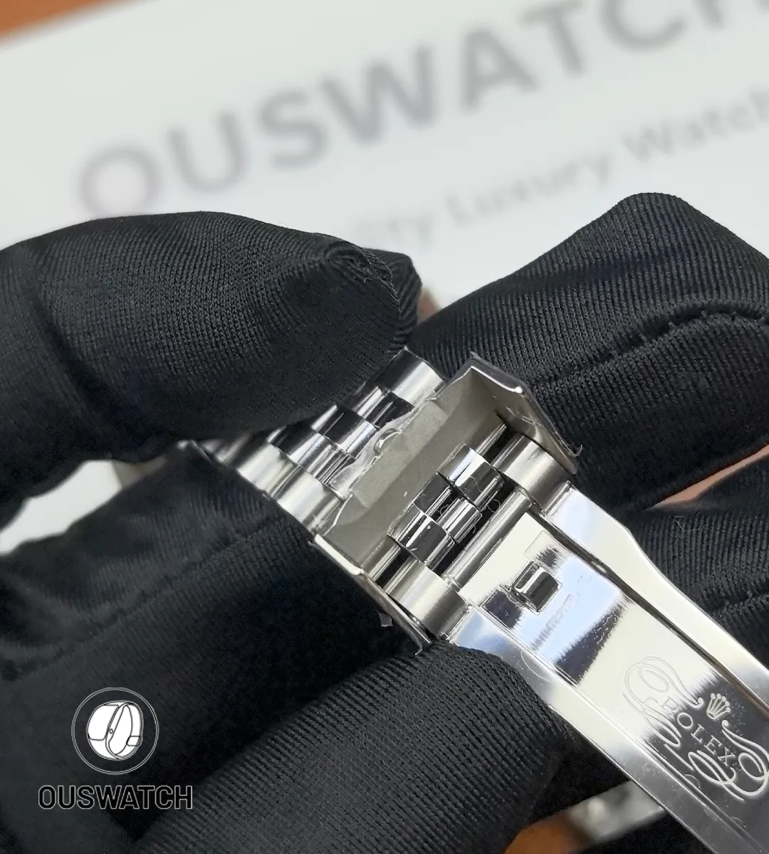 Detailed shot of the clasp on Rolex GMT-Master II 126710BLRO-0001 highlighting engraving and finish.