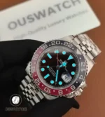 Rolex GMT-Master II 126710BLRO-0001 in low light — luminescent hour markers and hands visible.