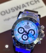 Rolex Daytona 116500LN white dial in low light showing lume and legibility.