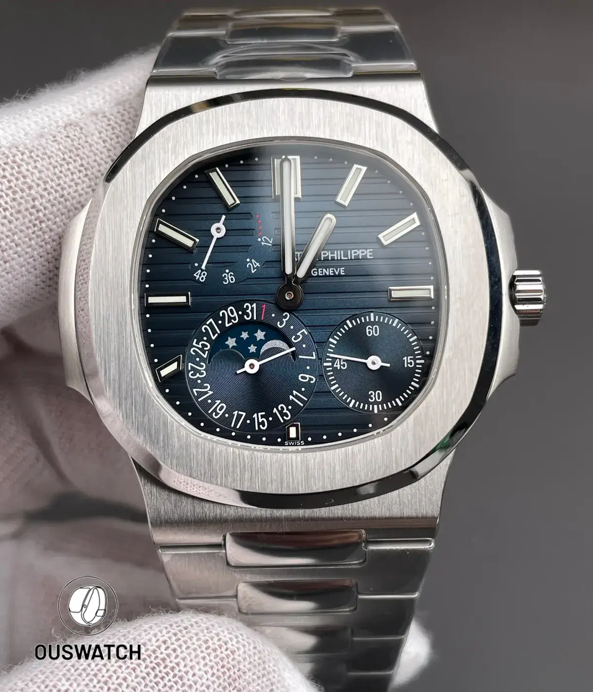 Close-up of the blue dial on a Patek 5712 replica watch showing moonphase, date, and power reserve details