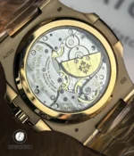 Macro of the exhibition caseback revealing the movement bridges, rotor decoration and finishing on the 5712R replica.