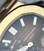 Detail shot of the bezel and applied hour markers on the 5712R, capturing how light plays across the indices and bezel facets.