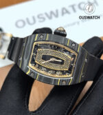 Horizontal close-up of the RM 07-01 dial that captures micro-texture, applied indices and the graceful handset.