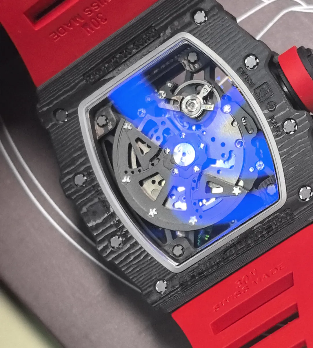 Rear macro of RM 35-02 exhibition caseback showing the exposed gear train, bridges and fine movement finishing.