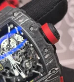 Close-up of the RM 35-02 crown revealing knurling, threaded stem detail and protective crown-guard shape.