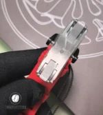 Stainless-steel folding clasp for RM 35-02 laid flat to show the locking mechanism, micro-adjust slots and brushed finish.