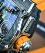 Action shot of the chronograph pusher being depressed, illustrating button travel and mechanical response.