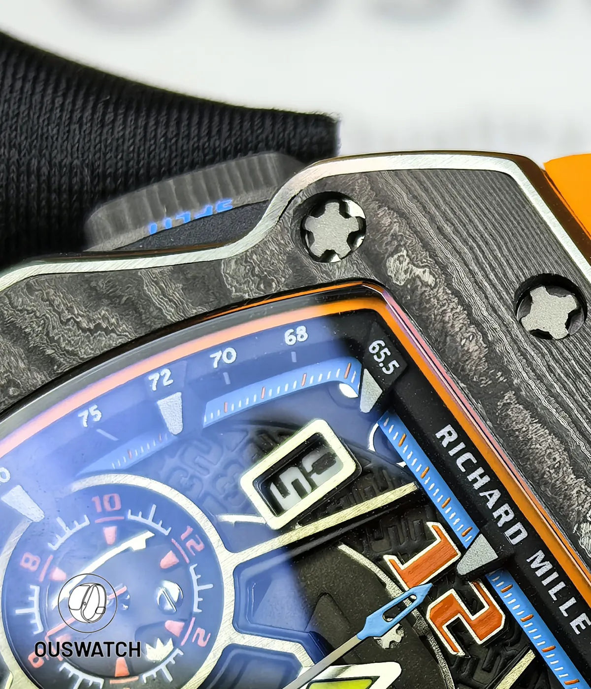 Macro view of the openworked dial showing subdial registers, flying seconds wheel and applied indices.