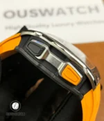 Close-up of the chronograph pushers highlighting tactile buttons, anodized accents and actuator geometry.