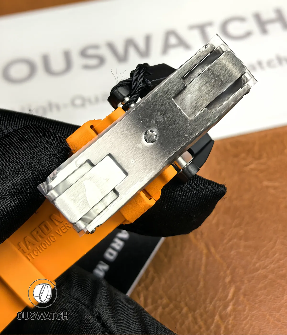 Close detail of the stainless-steel clasp showing the folding mechanism, micro-adjust slots and brushed finish.