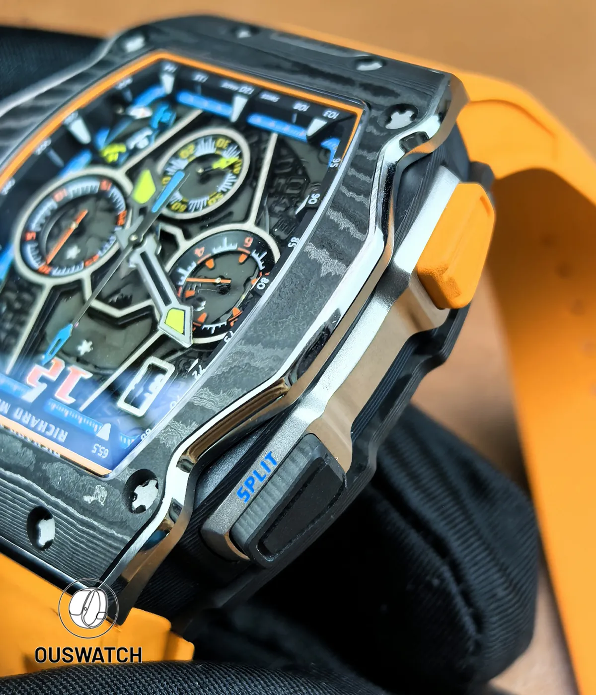 Detail of the titanium bezel frame showcasing brushed edges, screwed flange and satin-polished facets.