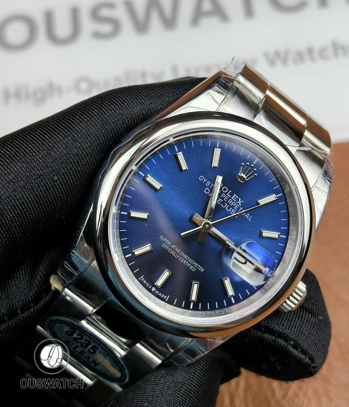 45-degree angled shot revealing the smooth bezel and polished lugs of the Datejust 126200 blue dial.