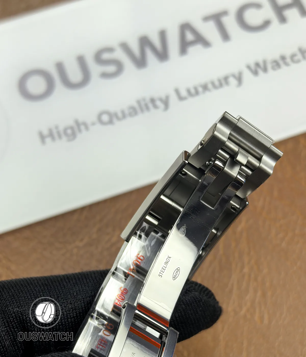 Macro detail of the folding clasp on Rolex Daytona 116500LN stainless steel bracelet.