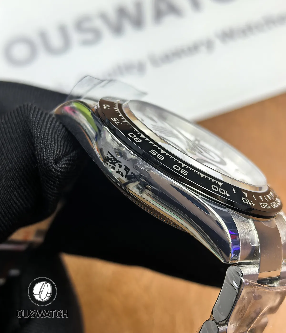 Side view showing the satin-brushed case finish of the Rolex Daytona 116500LN.