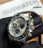 Close-up of the ceramic bezel and chronograph pushers on Rolex Daytona Ghost 126519LN-0006 white gold.