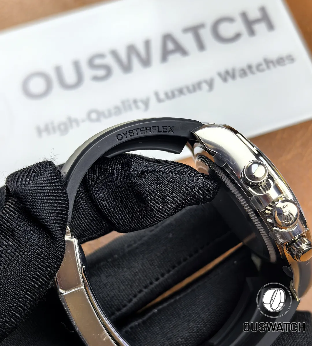 Close-up of the Oysterflex strap on Rolex Daytona Ghost 126519LN-0006, showing texture and endlink.