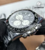 Detail of the black bezel and chronograph pushers on Rolex Daytona Le Mans 126529LN-0001.