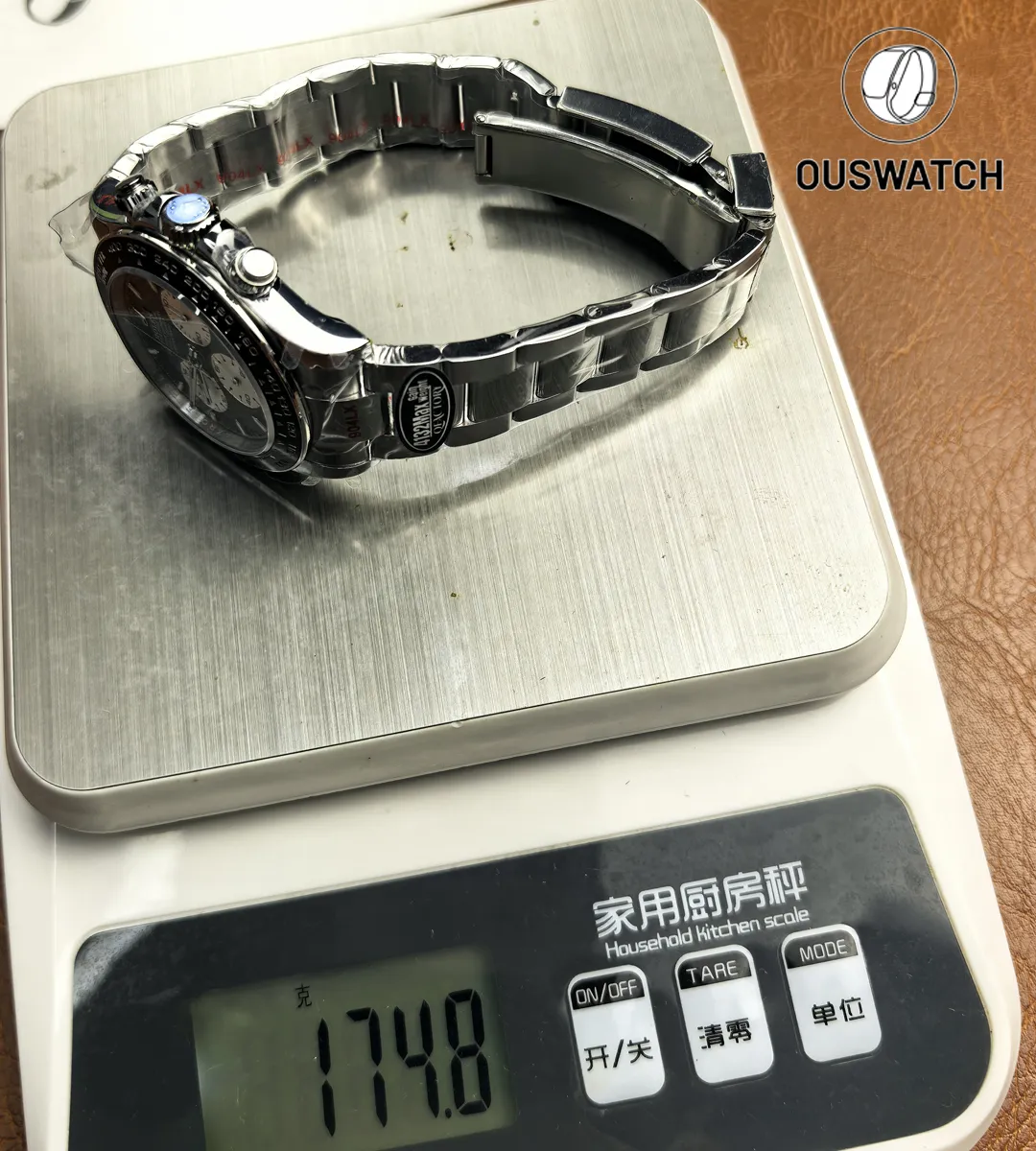 Weight measurement of Rolex Daytona Le Mans 126529LN-0001 on scale showing watch mass.