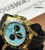 Close-up of the bezel and chronograph pushers on Rolex Daytona 126518LN yellow gold Tiffany blue.