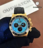 Rolex Daytona 126518LN yellow gold with Tiffany blue dial in low light showing lume performance.
