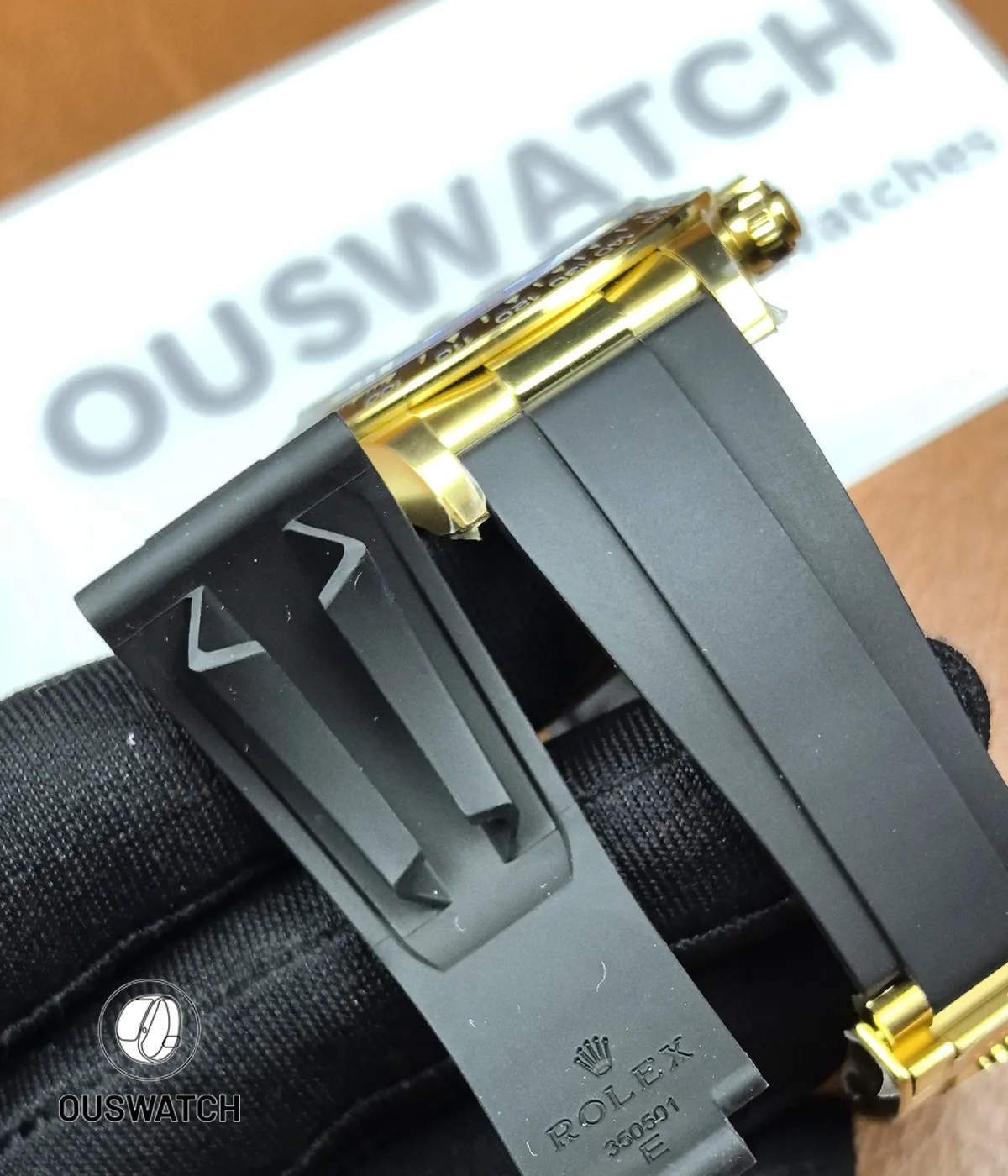 Close-up of the Oysterflex strap on Rolex Daytona 126518LN yellow gold Tiffany blue.