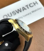 Side profile of Rolex Daytona 126518LN highlighting the yellow gold case.