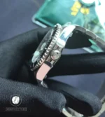 Macro view of the Deepsea case and screw-down crown revealing machining lines and crown-guard geometry.