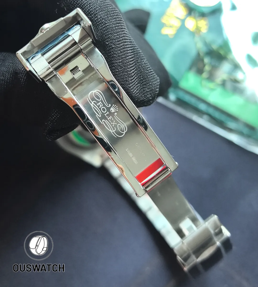 Unfolded Oystersteel clasp laid flat to reveal adjustment slots and the clasp’s engineering details.