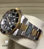 Tight composition of the 126603 bezel edge and bracelet link intersection, highlighting finishing contrasts.