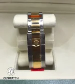 Oystersteel and yellow-gold clasp detail of the 126603, showing dual-metal finishing and locking mechanics.