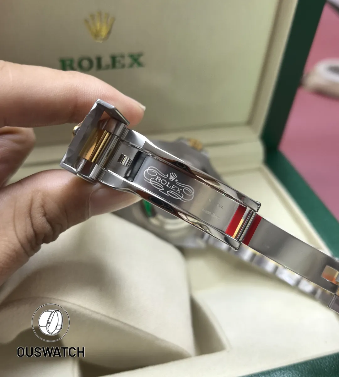 Fully unfolded two-tone folding clasp for the 126603, exposing adjustment slots and construction detail.