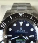 Blue-to-black gradient dial close-up on the 136660 capturing the oceanic ombré effect and applied markers.