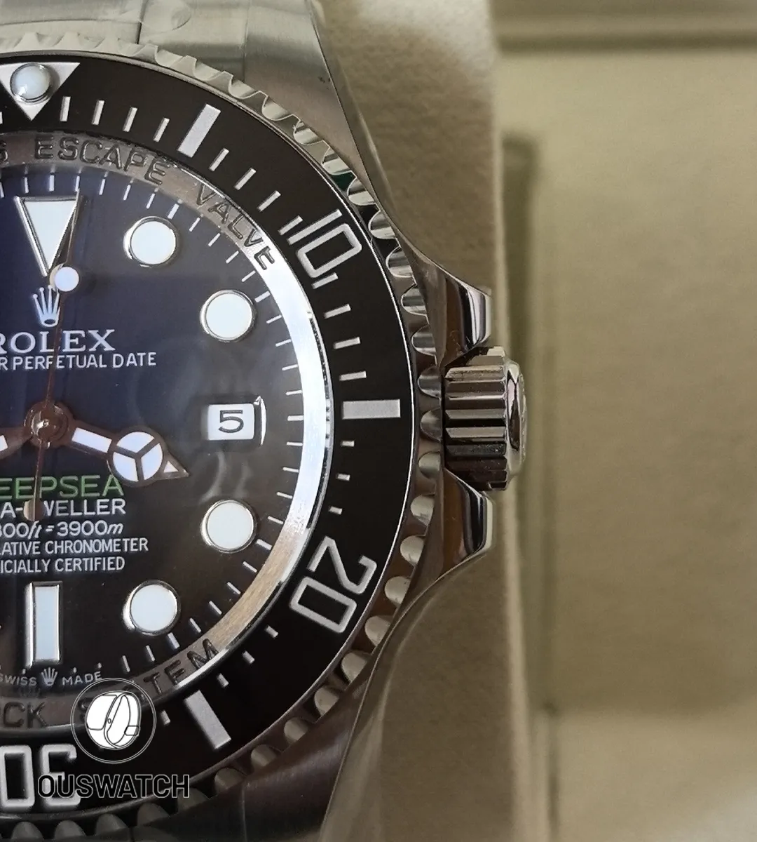 Ceramic bezel meeting the stainless steel case — a tight shot that highlights material contrast and finish.