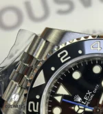 Close-up detail of the ceramic bezel on Rolex GMT-Master II 126710BLNR showing engraved numerals.