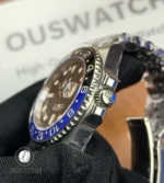 Stainless steel clasp and screw-down crown of the Rolex GMT-Master II 126710BLNR.