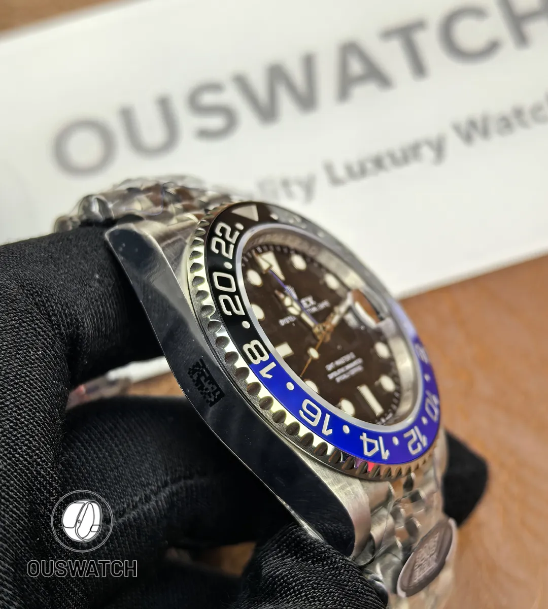 Side view of the stainless steel case on Rolex GMT-Master II 126710BLNR showing crown guards and finish.
