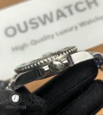 Close detail of the case and screw-down crown on Rolex GMT-Master II 126710GRNR-0003.