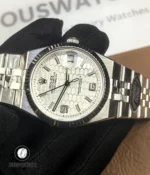 180° front-to-back overview of Rolex Land-Dweller 127334-0001 showing dial, case and bracelet.