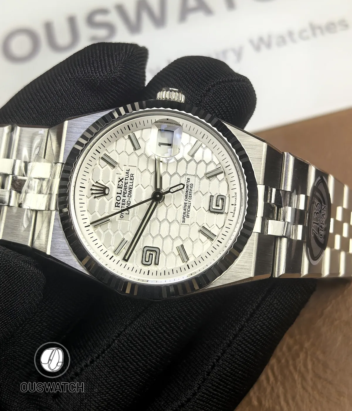 180° front-to-back overview of Rolex Land-Dweller 127334-0001 showing dial, case and bracelet.