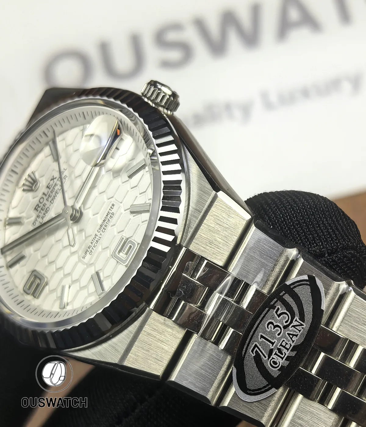 Close detail of the stainless steel case and bezel on Rolex Land-Dweller 127334-0001.