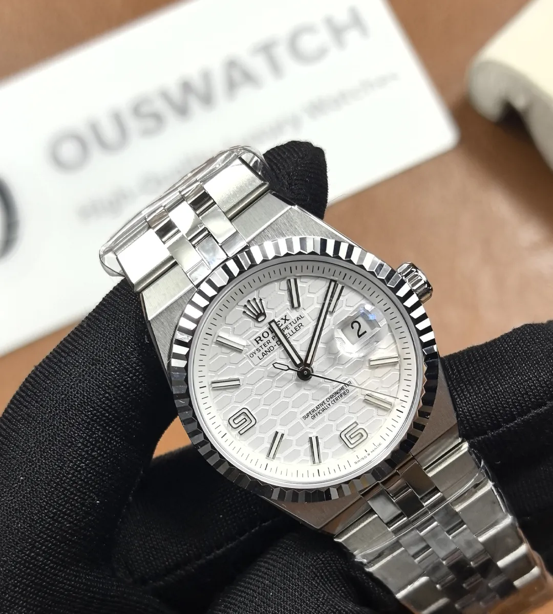 120° overview of Rolex Land-Dweller 36mm 127234 showing dial, case and bracelet.