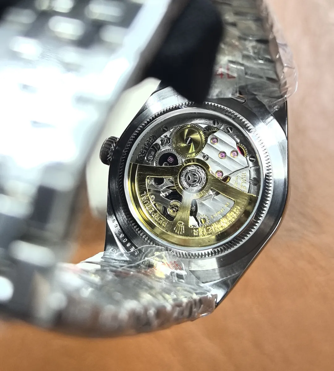 Back view of Rolex Land-Dweller 36mm 127234 showing caseback and bracelet attachment.