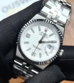 45° angle view of Rolex Land-Dweller 36mm 127234 with white dial and Jubilee bracelet.