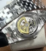 Rear close-up showing the caseback area and movement detail of Rolex Land-Dweller 127234.