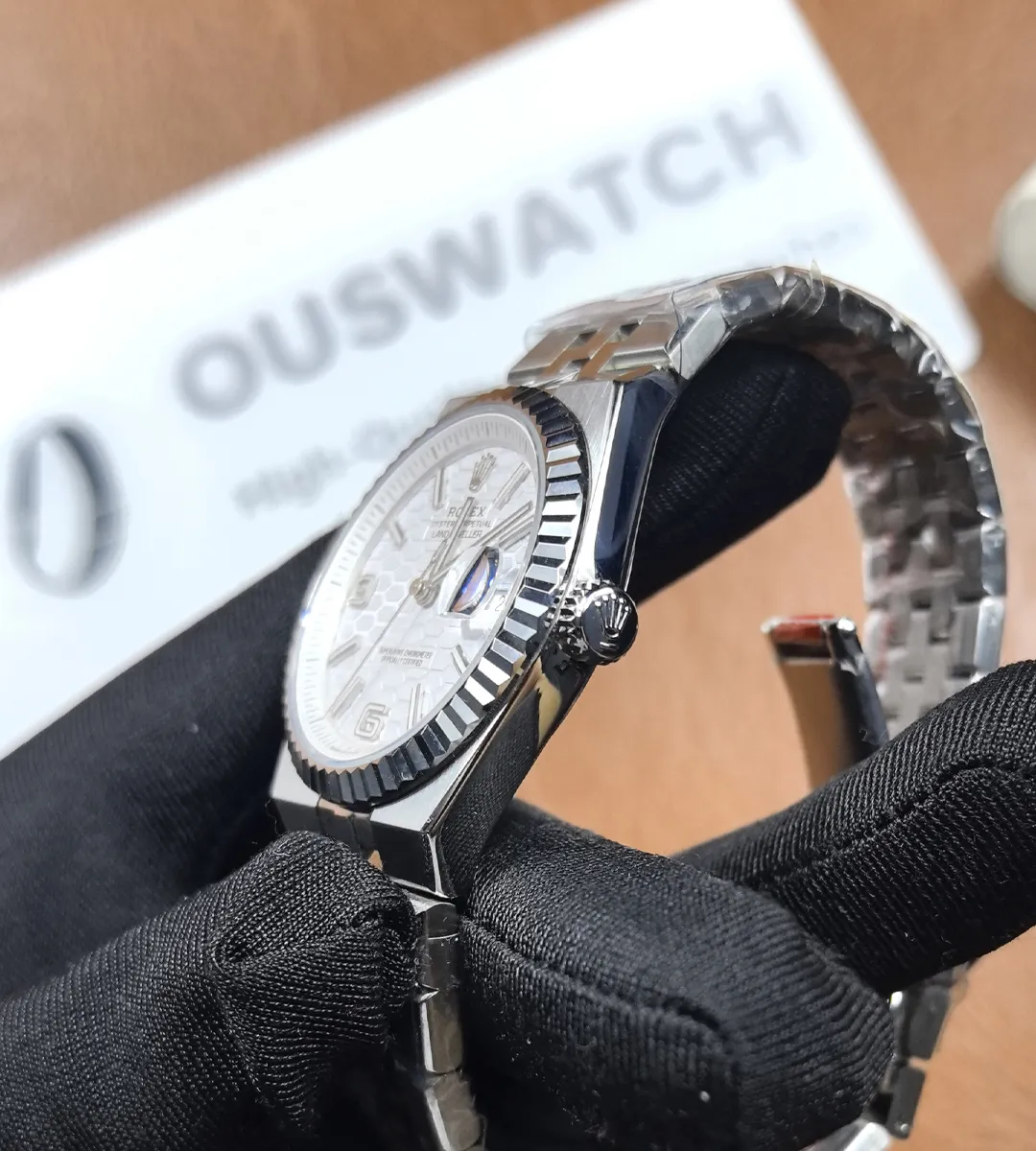 Side view of Rolex Land-Dweller 127234 case and screw-down crown detailing.